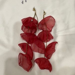 Red statement earrings.